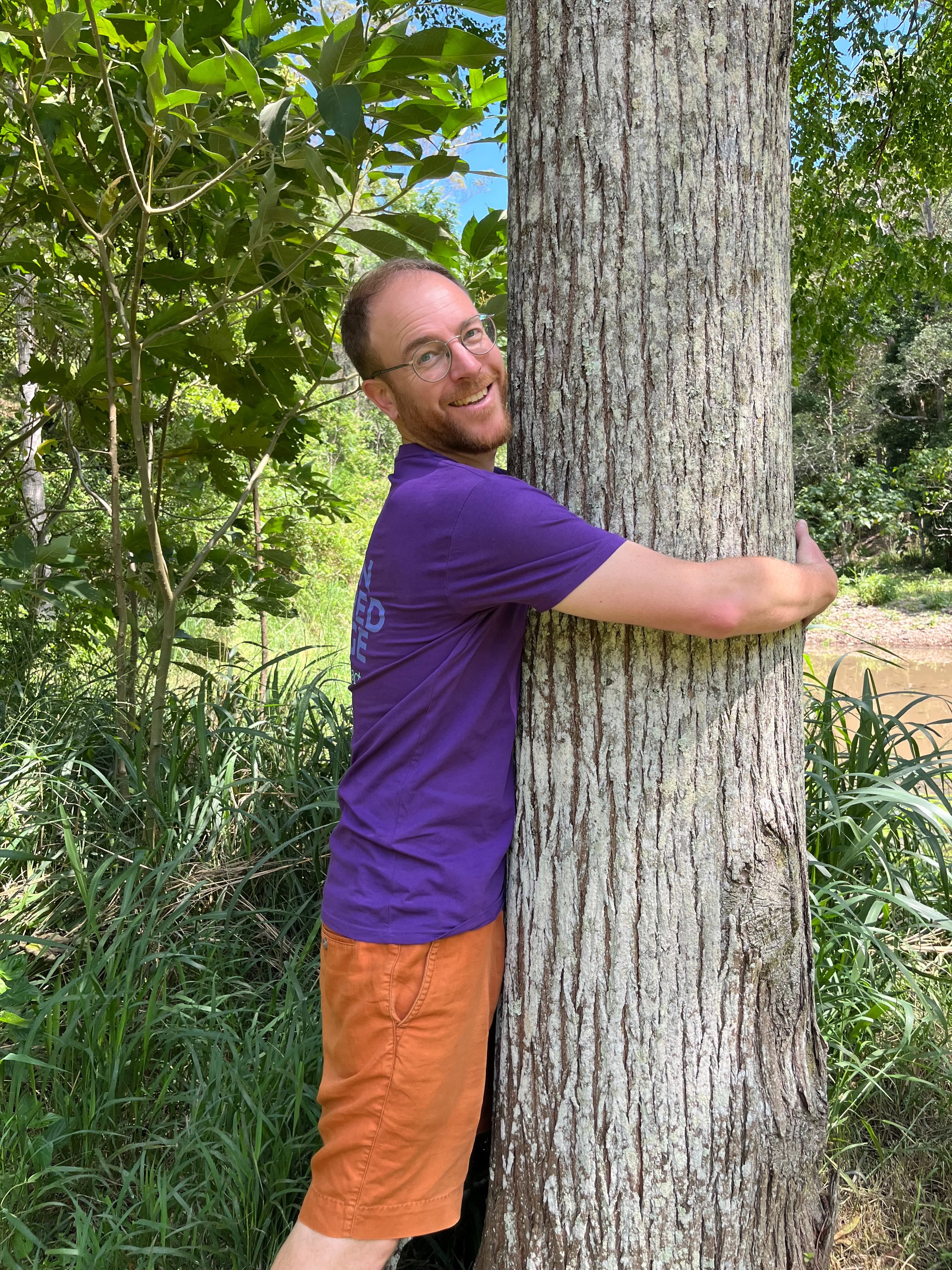 Volunteer taking practical action by planting in the forest